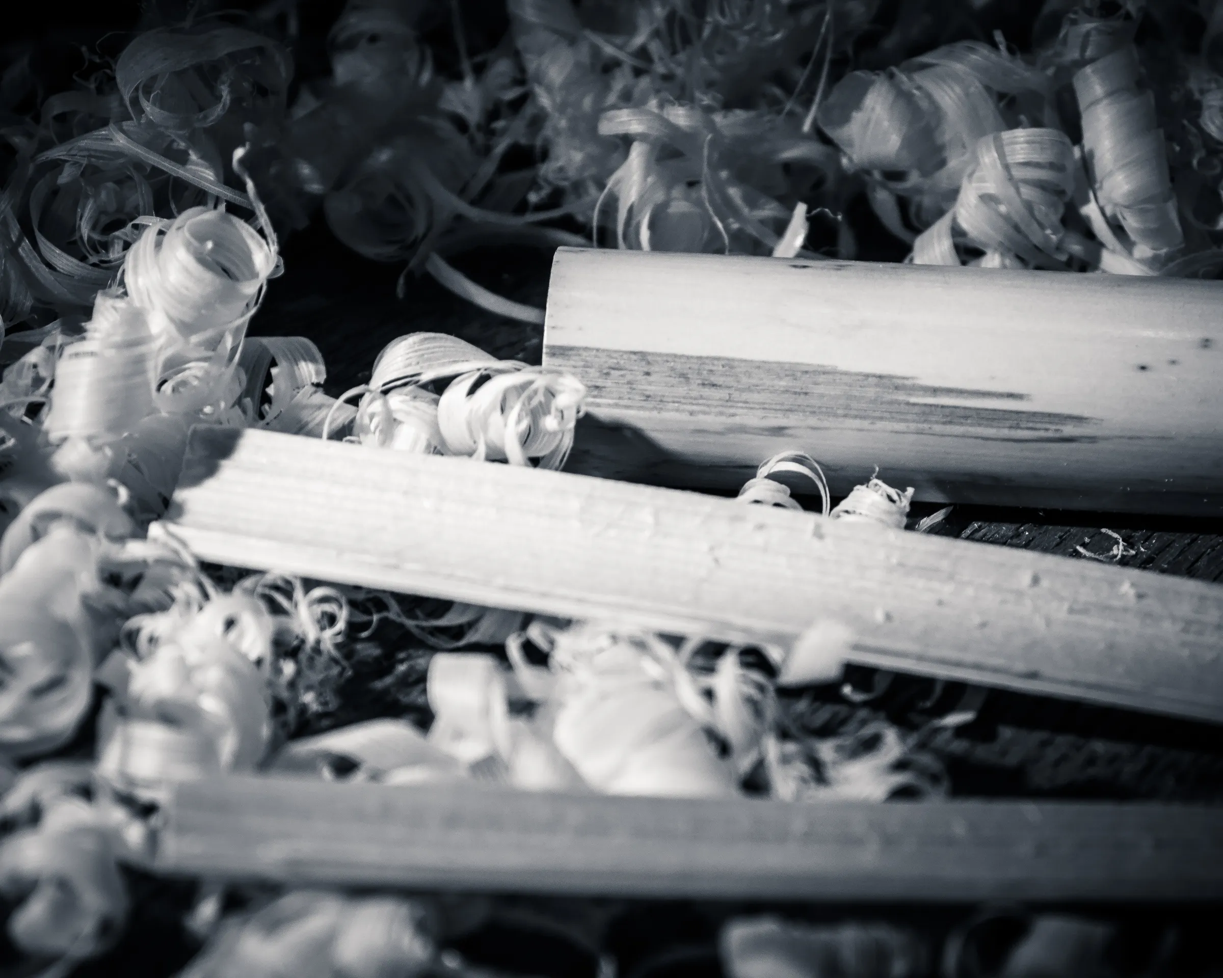 Close-up of scattered, tangled keys in black and white.