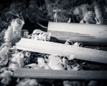 Close-up of scattered, tangled keys in black and white.