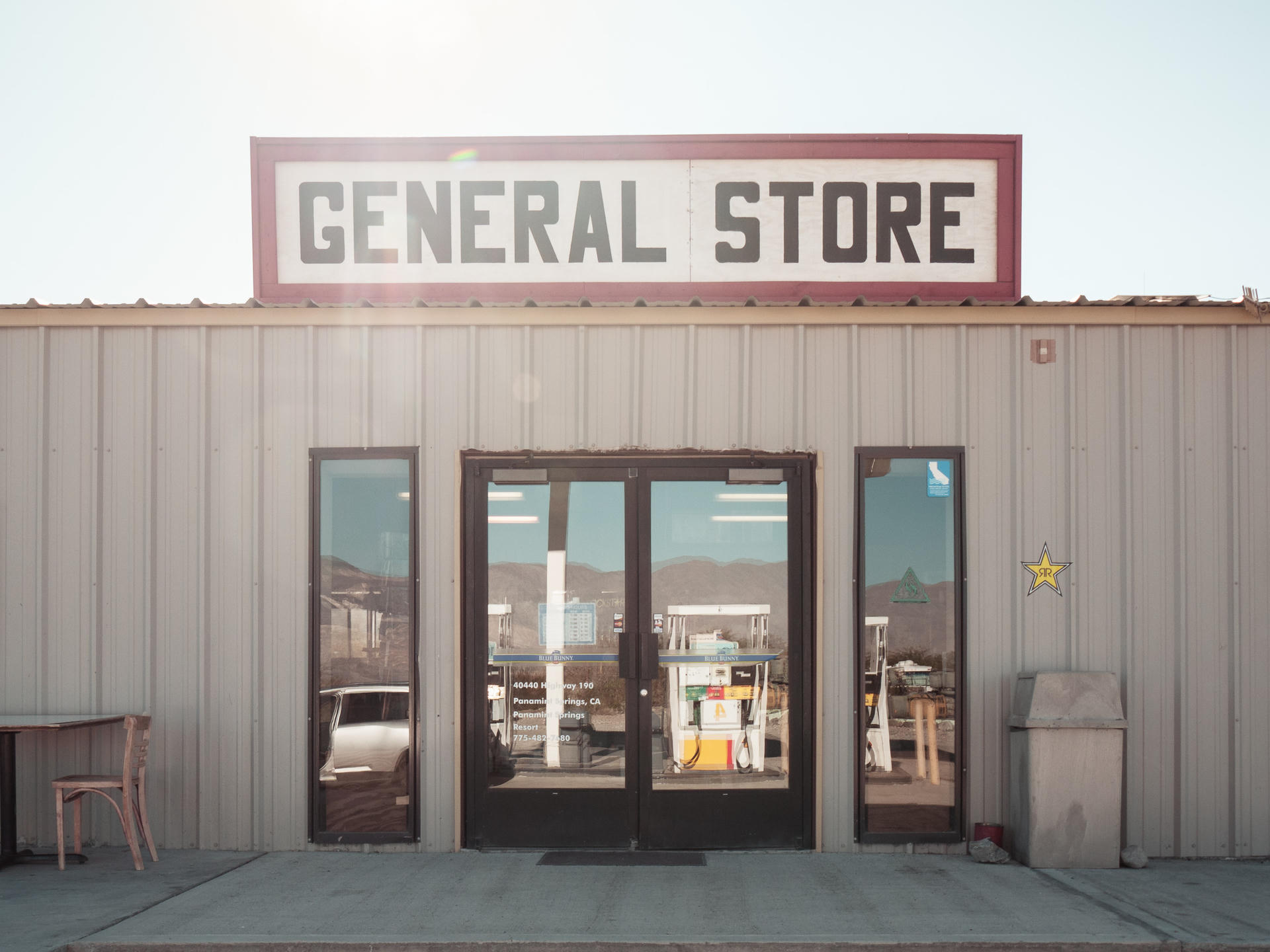General Store with large windows, sign on roof, and a star decal on the wall